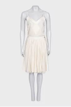 White dress with a pleated skirt