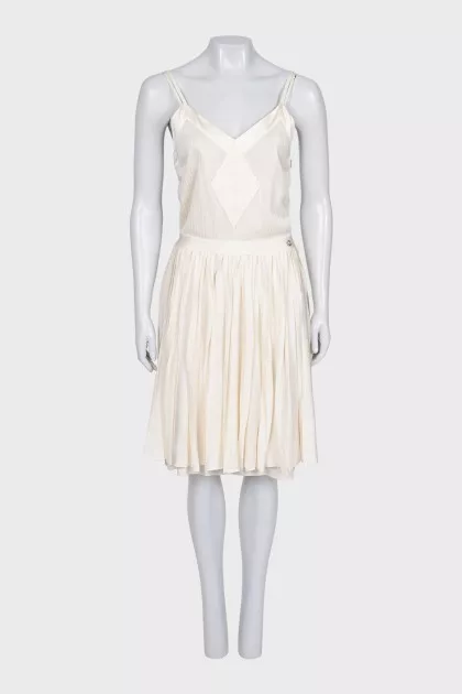 White dress with a pleated skirt