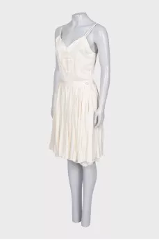 White dress with a pleated skirt