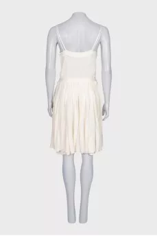 White dress with a pleated skirt