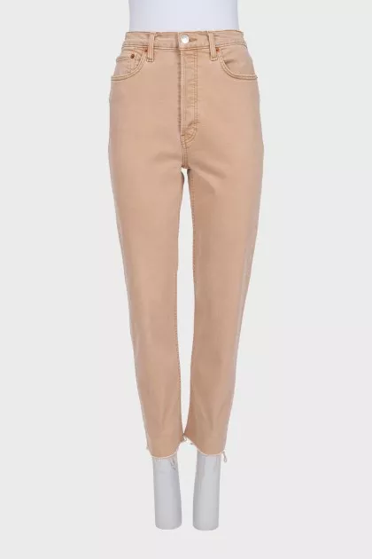 Brown jeans with raw hem