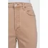 Brown jeans with raw hem