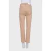 Brown jeans with raw hem