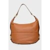 Bag on a belt with metal rings