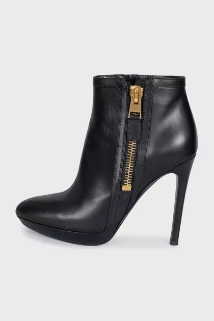 Leather ankle boots with heels and a gold zipper