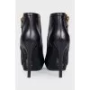 Leather ankle boots with heels and a gold zipper