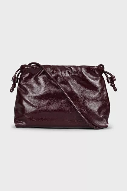 Burgundy bag with a magnetic closure