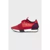 Red sneakers made of textile and leather