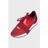 Red sneakers made of textile and leather