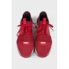 Red sneakers made of textile and leather