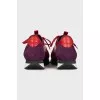 Red sneakers made of textile and leather