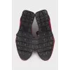Red sneakers made of textile and leather