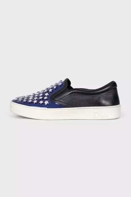 Blue leather slip-ons with decor