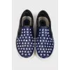 Blue leather slip-ons with decor