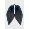 Blue suede pumps with a shaped heel