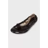 Patent leather ballet flats with pom-poms