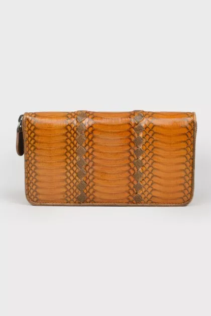 Wallet with an embossed snake pattern