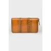 Wallet with an embossed snake pattern