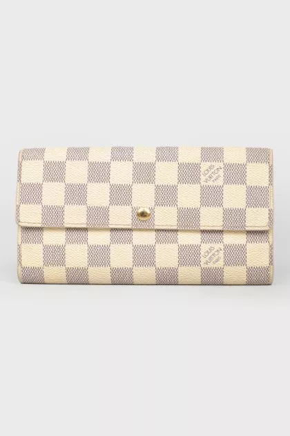 White wallet in a corporate print