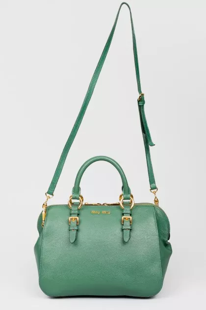 Green bag with golden fittings