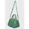 Green bag with golden fittings