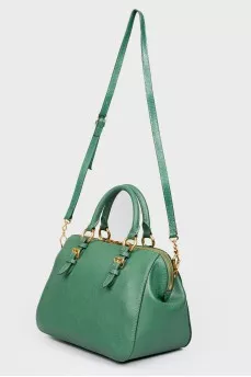 Green bag with golden fittings