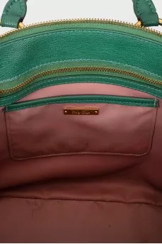 Green bag with golden fittings