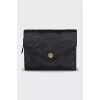 Black wallet with branded embossing