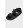 Black leather sandals with gold hardware