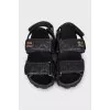 Black leather sandals with gold hardware