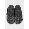 Black leather sandals with gold hardware