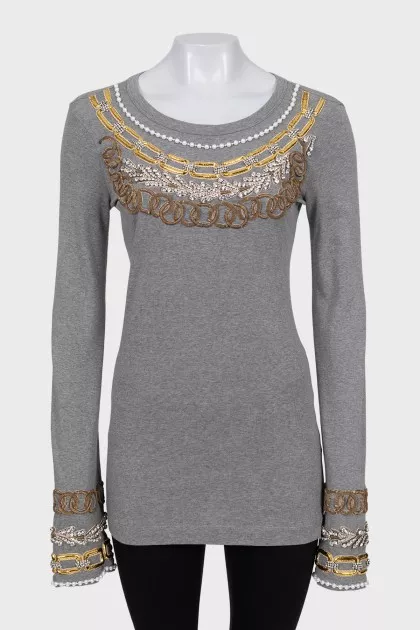 Long sleeve decorated with crystals and beads
