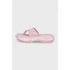 Pink suede flip-flops