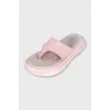 Pink suede flip-flops
