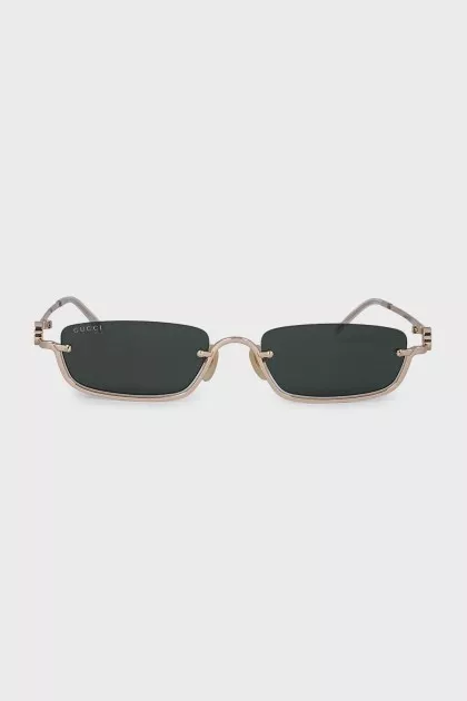 Rectangular sunglasses with green tint