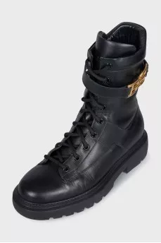 Leather boots with a gold brand logo