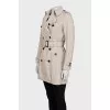 Beige cropped trench coat with belt