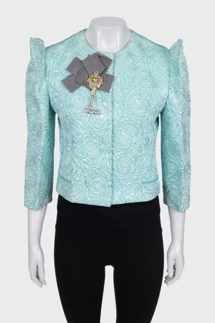 A shimmery jacket with accent shoulders