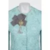 A shimmery jacket with accent shoulders