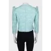 A shimmery jacket with accent shoulders
