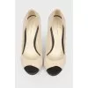 Beige shoes with black heels