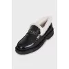 Black loafers with fur
