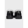 Black loafers with fur
