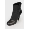 Heeled boots with metal inserts