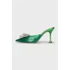 Green mules decorated with rhinestones