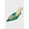 Green mules decorated with rhinestones