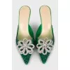 Green mules decorated with rhinestones