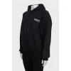 Black hoodie with logo on the back