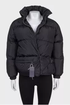 Black down jacket with zip pockets and tag