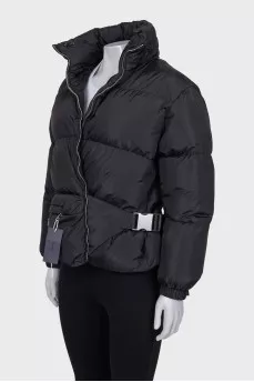 Black down jacket with zip pockets and tag